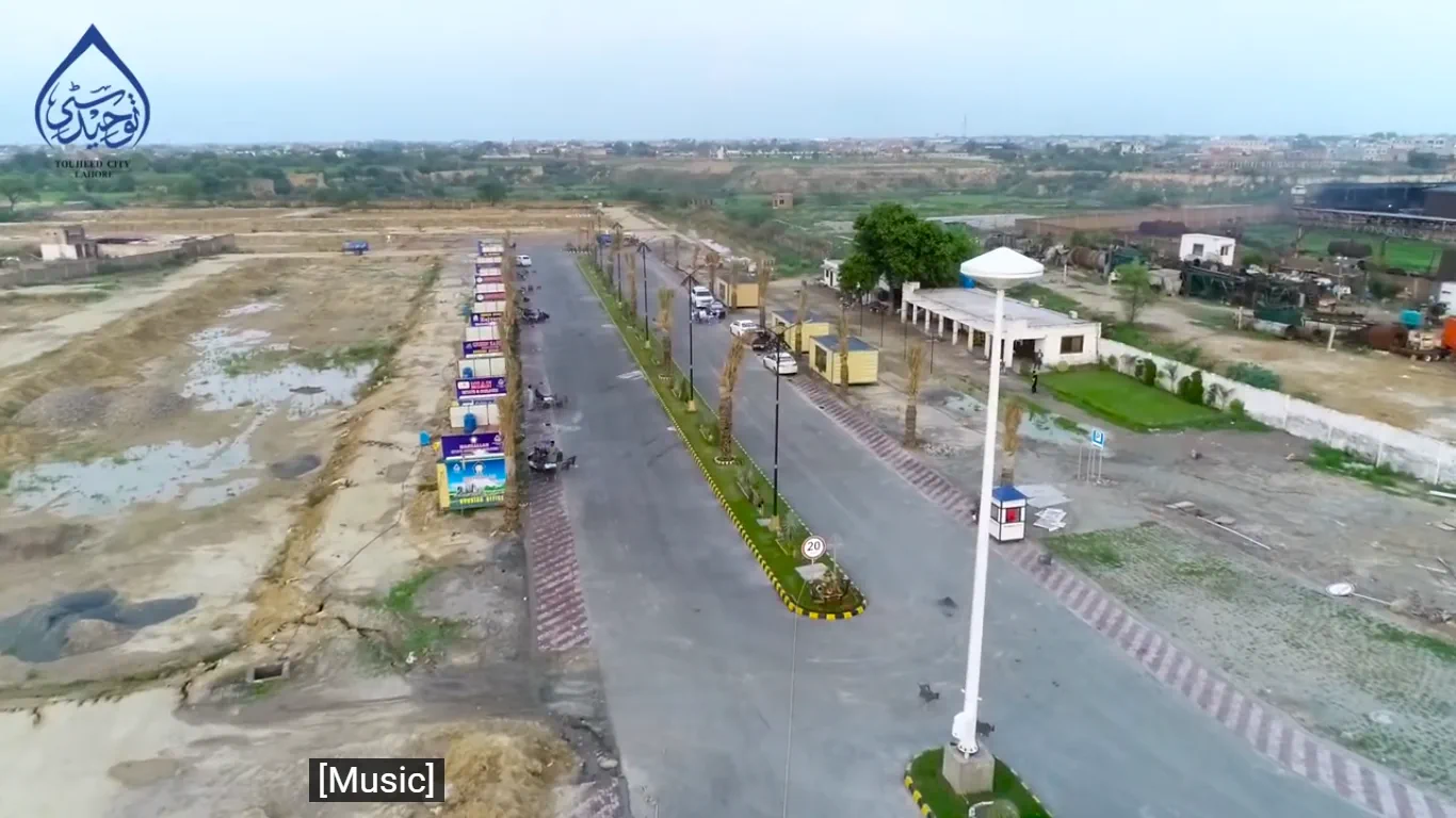 Touheed City Lahore entrance boulevard, aerial view of the main road and sales offices